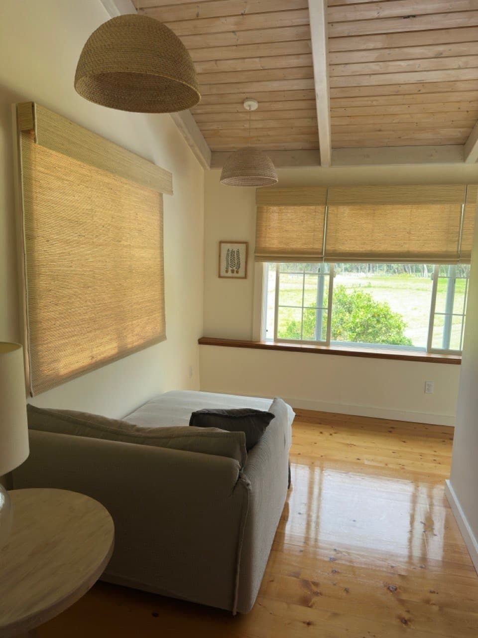 Living room with custom woven wood blinds